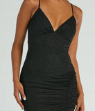 Make a bold statement in the Melinda V-Neck Slit Mermaid Glitter Formal Dress in black, the perfect spring dress for weddings, cocktail hours, nights out, and/or seasonal celebrations.