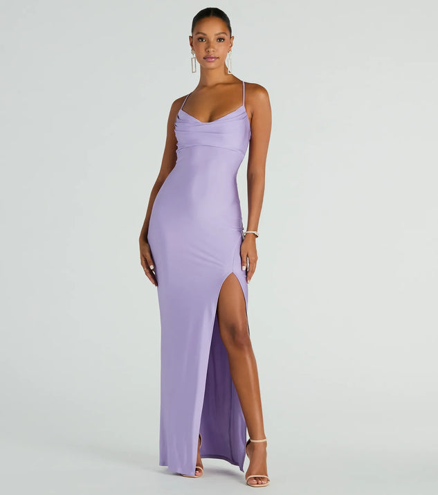 Turn heads at Prom 2025 in this lavender prom dress, where statement-making details meet the iconic style of the Natalie Cowl Neck Lace Up Slit Formal Dress .