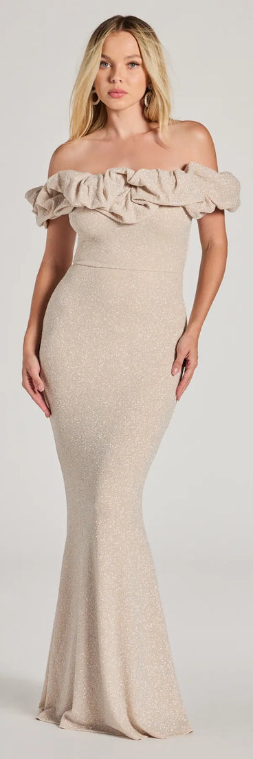 Turn heads at Prom 2025 in this ivory prom dress, where statement-making details meet the iconic style of the Halsey Formal Glitter Ruffled Mermaid Dress .