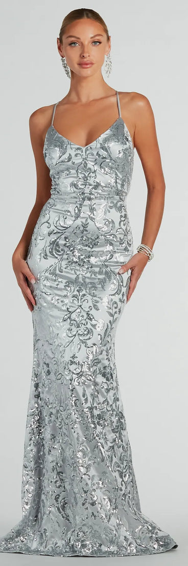 Turn heads in the beaming Holly Lace-Up Sequin Satin Formal Dress, a stunning silver sequin dress designed to add sparkle and elegance to your next night out or special occasion.