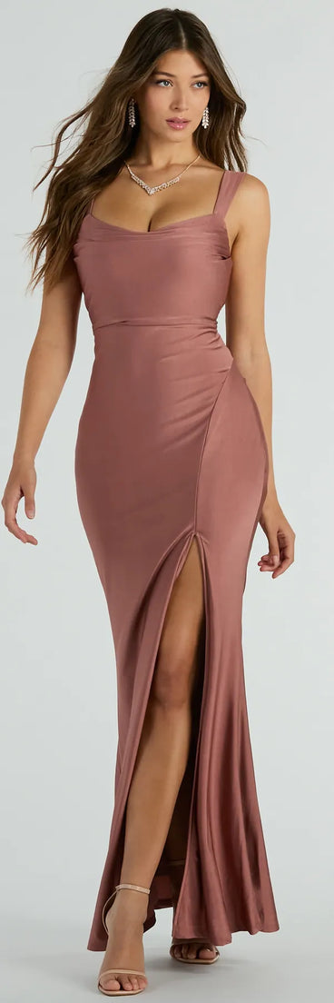 You'll be the best dressed in the Tiffany Lace-Up Slit Mermaid Formal Dress as your formal prom dress with beautiful and unique details from Windsor.