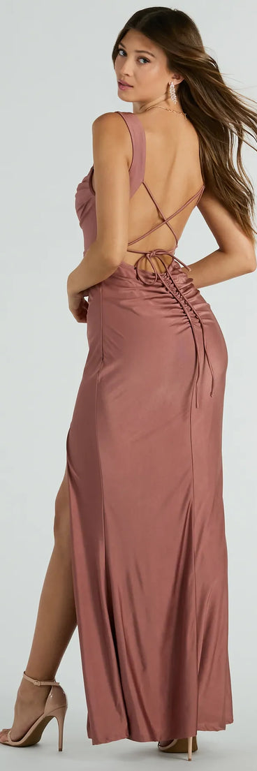 You'll be the best dressed in the Tiffany Lace-Up Slit Mermaid Formal Dress as your formal prom dress with beautiful and unique details from Windsor.