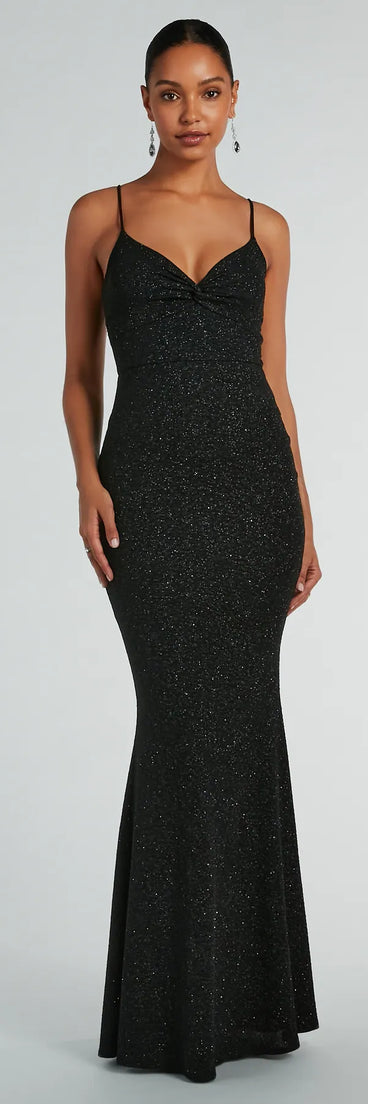 Turn heads at Prom 2025 in this black prom dress, where statement-making details meet the iconic style of the Maleah Twist-Front Glitter Knit Mermaid Dress .