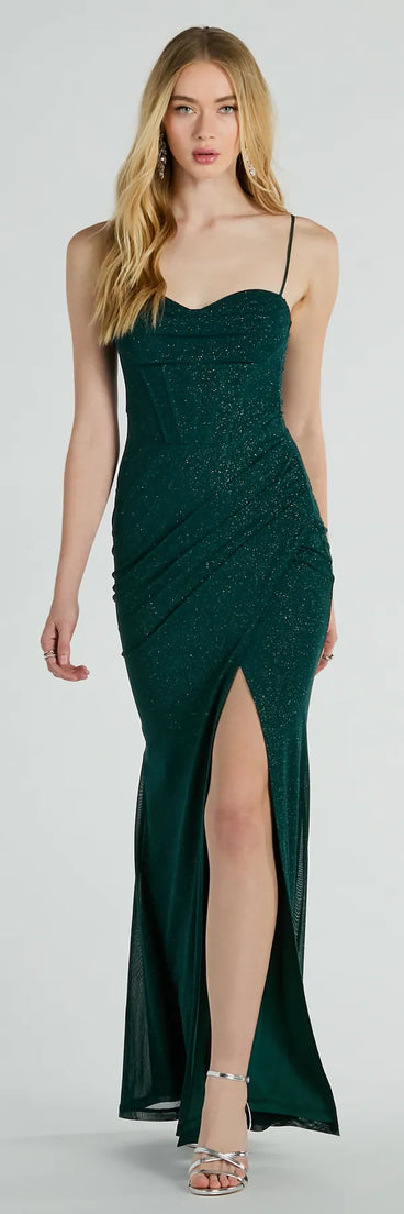 Turn heads at Prom 2025 in this hunter green prom dress, where statement-making details meet the iconic style of the Daleyza Bustier Slit Glitter Column Formal Dress .