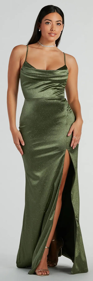 The Melody Cowl Neck Mermaid Glitter Satin Formal Dress is a shimmery olive glitter dress that catches the light beautifully, perfect for any special outfit like Winter Formal attire, clubwear, or a wedding guest dress.