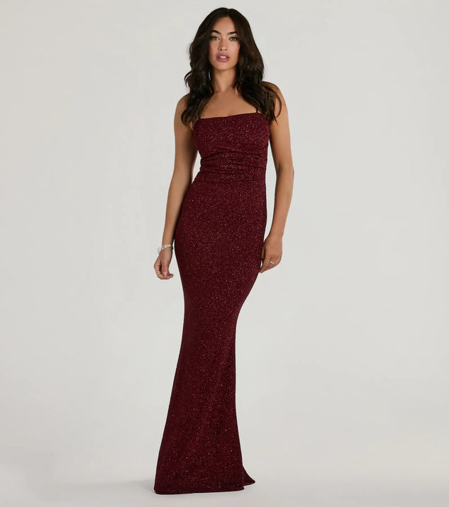 Turn heads at Prom 2025 in this wine prom dress, where statement-making details meet the iconic style of the Wendy Sleeveless Mermaid Glitter Formal Dress .
