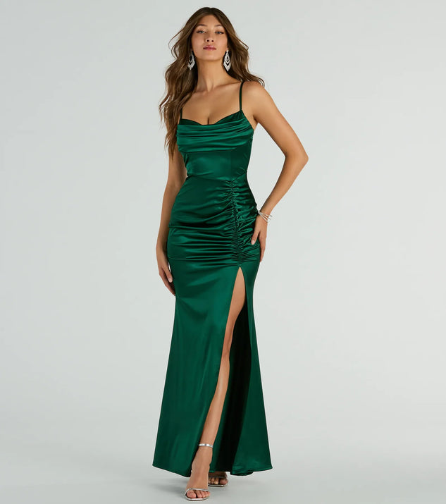 Turn heads at Prom 2025 in this hunter green prom dress, where statement-making details meet the iconic style of the Jazmine Cowl Neck Slit A-Line Satin Formal Dress .