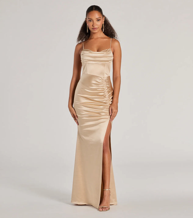 Turn heads at Prom 2025 in this taupe prom dress, where statement-making details meet the iconic style of the Jazmine Cowl Neck Slit A-Line Satin Formal Dress .