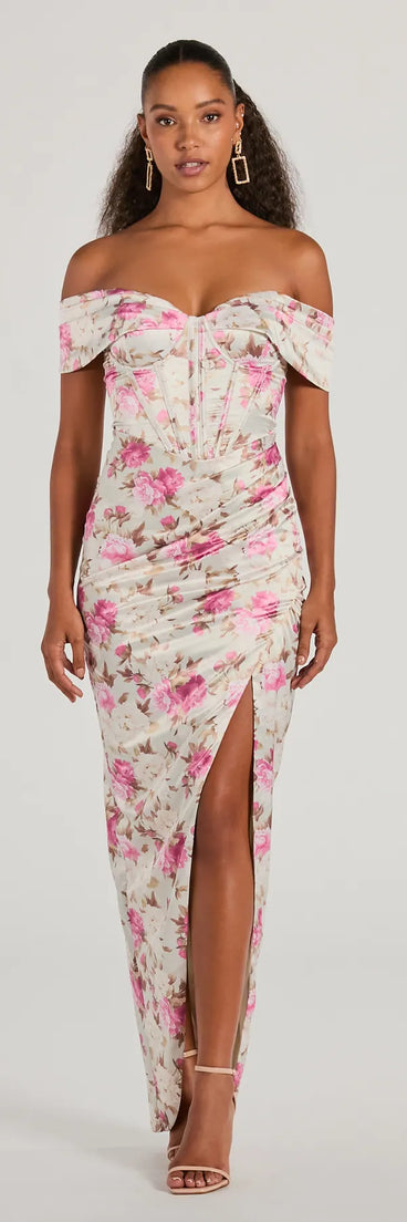 Turn heads at Prom 2025 in this taupe prom dress, where statement-making details meet the iconic style of the Mildred Off-The-Shoulder Floral Satin Formal Dress .