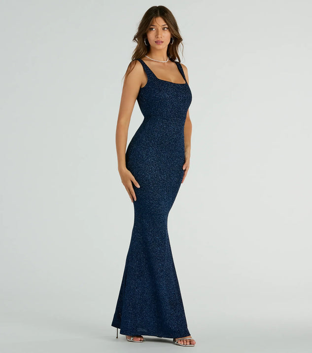 You'll be the best dressed in the Cadence Sleeveless Mermaid Glitter Formal Dress as your summer formal dress with unique details from Windsor.