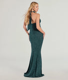 The Nayeli Halter Slit Mermaid Glitter Formal Dress in hunter is a stunning green prom dress designed to capture attention with its fresh or bold color and effortlessly stylish silhouette.