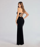 The Margo Velvet Strapless High Slit Mermaid Dress is a show-stopping black prom dress, offering a sleek, slimming silhouette that enhances your natural beauty for an unforgettable night.