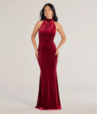 Turn heads at Prom 2025 in this wine prom dress, where statement-making details meet the iconic style of the Nara Long Velvet Halter Mermaid Dress .