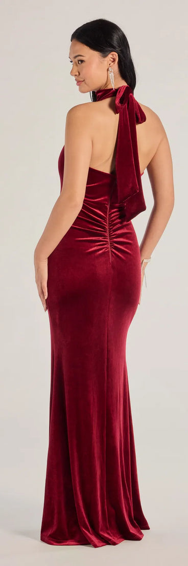 Make a statement in the Nara Long Velvet Halter Mermaid Dress in wine, a bold red prom dress designed to exude confidence, elegance, and a striking prom-night look.