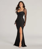 Turn heads at Prom 2025 in this black prom dress, where statement-making details meet the iconic style of the Connie Long Sleeve Glitter Slim Formal Dress .