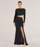 Turn heads at Prom 2025 in this black prom dress, where statement-making details meet the iconic style of the Brynn Long Sleeve Glitter Cutout Mermaid Dress .