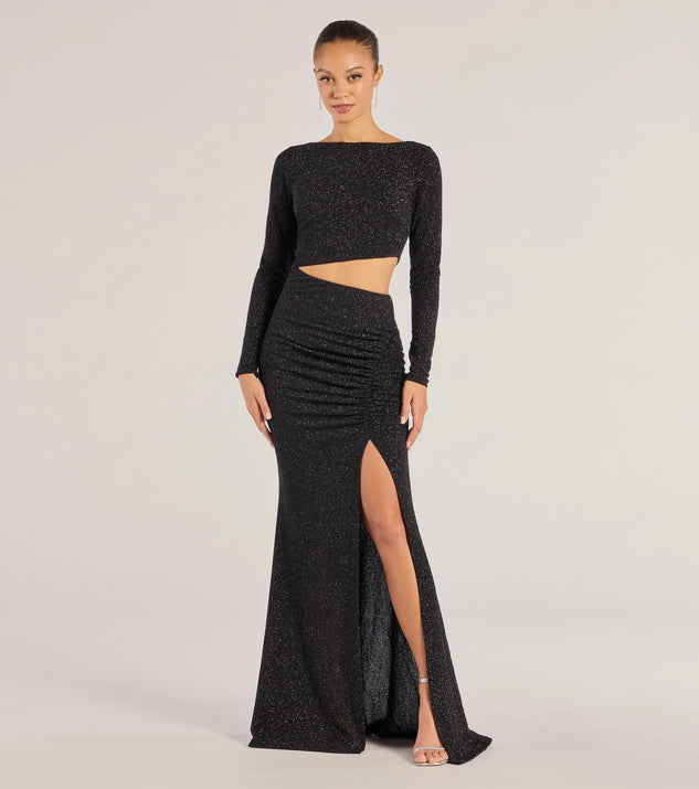Turn heads at Prom 2025 in this black prom dress, where statement-making details meet the iconic style of the Brynn Long Sleeve Glitter Cutout Mermaid Dress .