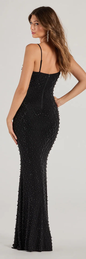 The Elliot Rhinestone And Pearl Mesh Mermaid Dress is a show-stopping black homecoming dress, offering a sleek, slimming silhouette that enhances your natural beauty for an unforgettable night.