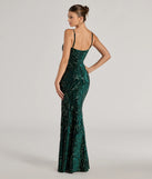 The Lilia Sequin Velvet High Slit Column Dress in hunter is a stunning green prom dress designed to capture attention with its fresh or bold color and effortlessly stylish silhouette.