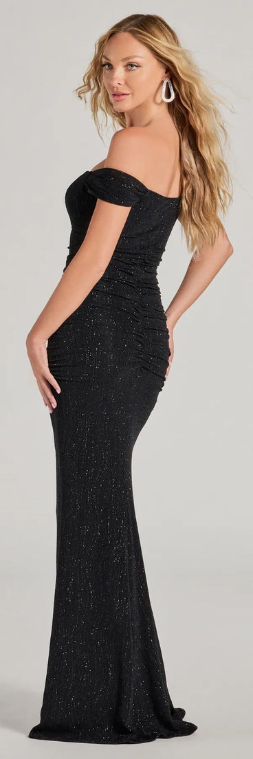 Celebrate in style with the Ines Glitter Lurex Off-The-Shoulder Mermaid Dress, a black formal wedding guest dress featuring an elegant silhouette and luxe details, perfect for a black-tie celebration.