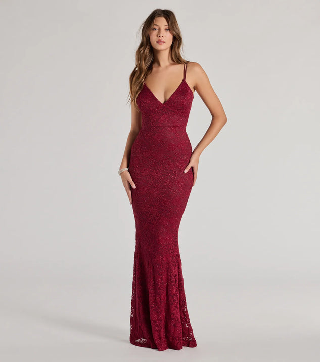 Turn heads at Prom 2025 in this wine prom dress, where statement-making details meet the iconic style of the Briella Glitter Lace Cross-Back Mermaid Dress .