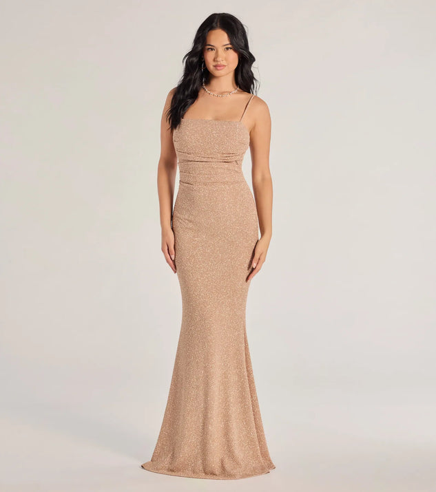 Turn heads at Prom 2025 in this mauve prom dress, where statement-making details meet the iconic style of the Wendy Sleeveless Mermaid Glitter Formal Dress .