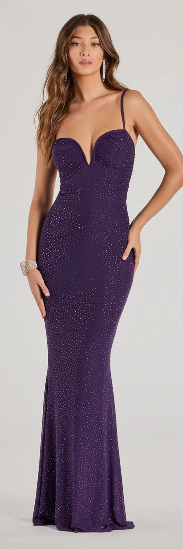 Turn heads at Prom 2025 in this purple prom dress, where statement-making details meet the iconic style of the Jemma Embellished Studded Sleeveless Mermaid Dress .