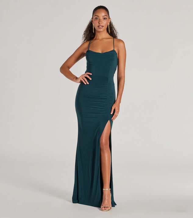 Turn heads at Prom 2025 in this hunter green prom dress, where statement-making details meet the iconic style of the Ashley Sleeveless Bow Mermaid Formal Dress .