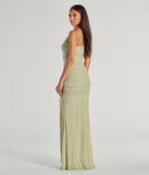 The Annika Pearl And Rhinestone Ruched Mesh Mermaid Dress in sage is a stunning green prom dress designed to capture attention with its fresh or bold color and effortlessly stylish silhouette.