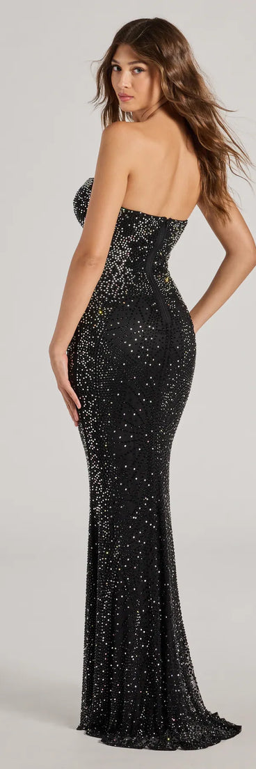 The Adelyn Rhinestone Mesh Strapless Mermaid Dress is a show-stopping black prom dress, offering a sleek, slimming silhouette that enhances your natural beauty for an unforgettable night.