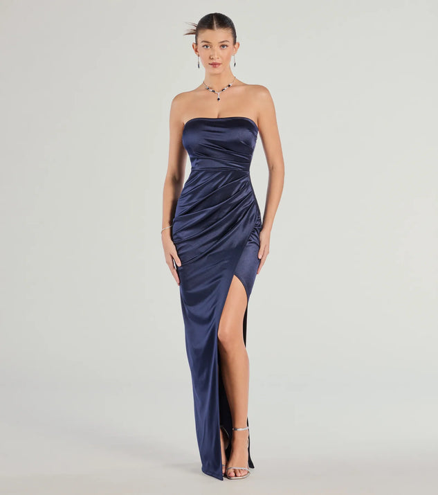 Turn heads at Prom 2025 in this navy blue prom dress, where statement-making details meet the iconic style of the Lauren Strapless Wrap Slim Satin Formal Dress .