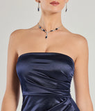 Make a bold statement in the Lauren Strapless Wrap Slim Satin Formal Dress in navy blue, the perfect spring dress for weddings, cocktail hours, nights out, and/or seasonal celebrations.