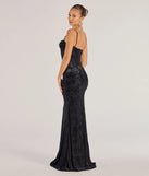 The Alessandra Sleeveless Flocked Velvet Mermaid Dress is a show-stopping black prom dress, offering a sleek, slimming silhouette that enhances your natural beauty for an unforgettable night.