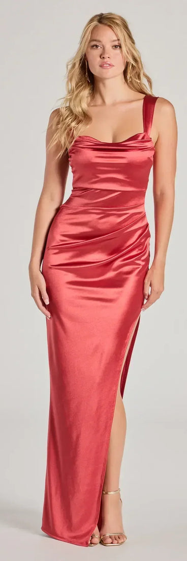 Turn heads at HOCO 2025 in this rust homecoming dress, where statement-making details meet the iconic style of the Kirsten Satin Cowl Neck High Slit Formal Dress.