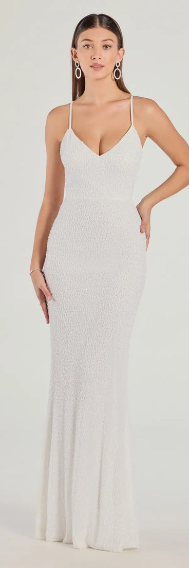 Turn heads at HOCO 2025 in this white homecoming dress, where statement-making details meet the iconic style of the Rani Sleeveless Strappy Open-Back Beaded Mermaid Dress.