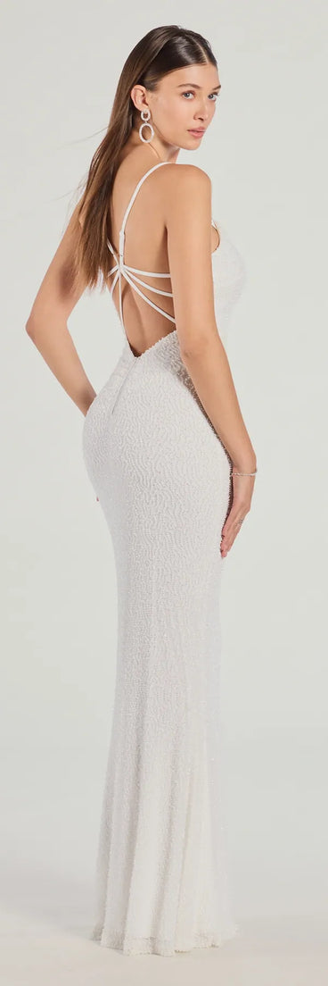 Own the spotlight in the Rani Sleeveless Strappy Open-Back Beaded Mermaid Dress, a white formal dress crafted to deliver luxe style for summer weddings, Army Balls, or any special event.