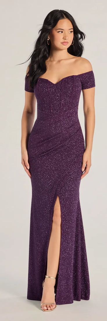 Turn heads at Prom 2025 in this purple prom dress, where statement-making details meet the iconic style of the Mimi Off The Shoulder Glitter Mermaid Corset Dress .