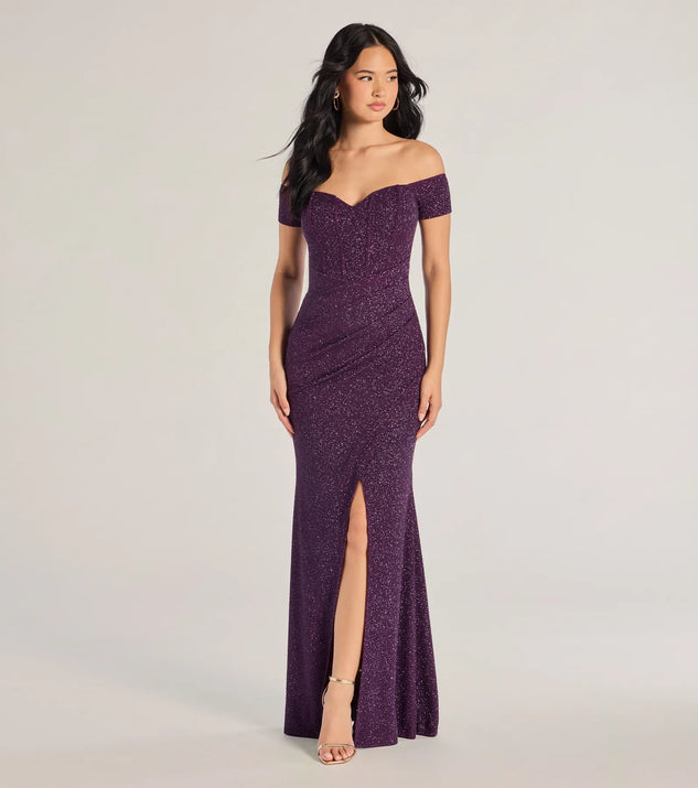 Turn heads at Prom 2025 in this purple prom dress, where statement-making details meet the iconic style of the Mimi Off The Shoulder Glitter Mermaid Corset Dress .