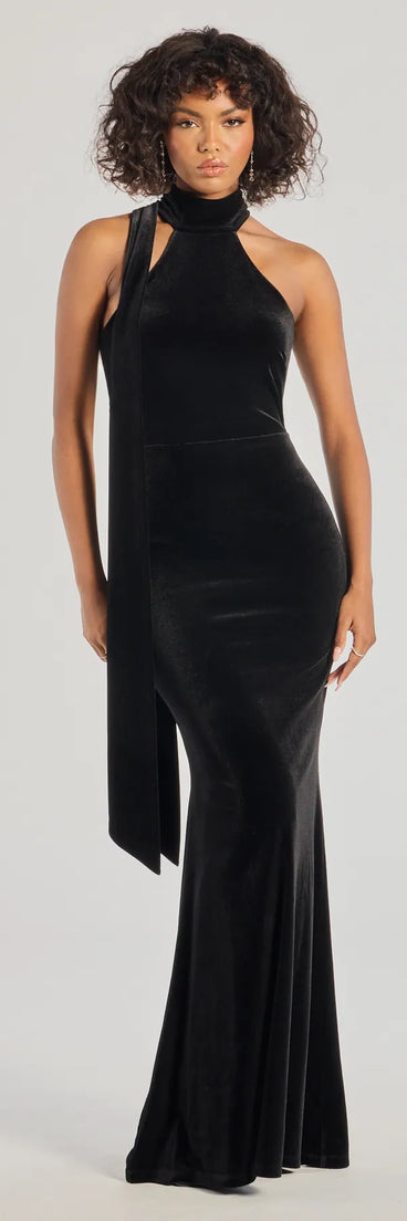 Feel instantly put-together in the Dawn Open-Back Velvet Mermaid Dress With Sash in black, a stylish wedding guest dress designed for confident style and all-out celebration.