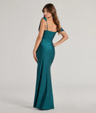 The Cynthia One-Shoulder Cowl Neck Mermaid Dress in hunter is a stunning green prom dress designed to capture attention with its fresh or bold color and effortlessly stylish silhouette.