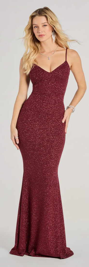 Turn heads at Prom 2025 in this wine prom dress, where statement-making details meet the iconic style of the Tricia V-Neck Open Back Mermaid Glitter Formal Dress .