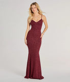 Turn heads at Prom 2025 in this wine prom dress, where statement-making details meet the iconic style of the Tricia V-Neck Open Back Mermaid Glitter Formal Dress .