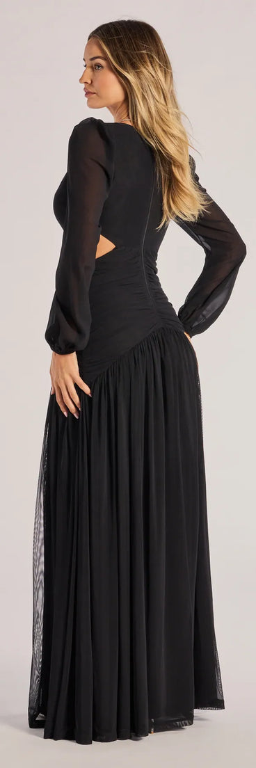 The Adley Long Sleeve Cutout Mesh Formal Dress is a show-stopping black prom dress, offering a sleek, slimming silhouette that enhances your natural beauty for an unforgettable night.