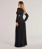 The Adley Long Sleeve Cutout Mesh Formal Dress is a show-stopping black prom dress, offering a sleek, slimming silhouette that enhances your natural beauty for an unforgettable night.