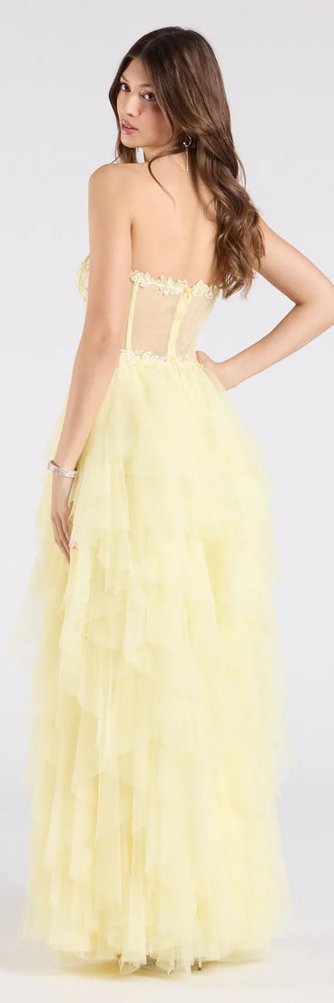 Make a bold statement in the Keyla Floral Applique Tiered Ruffle Tulle Gown in yellow, the perfect summer dress for weddings, cocktail hours, nights out, and/or seasonal celebrations.