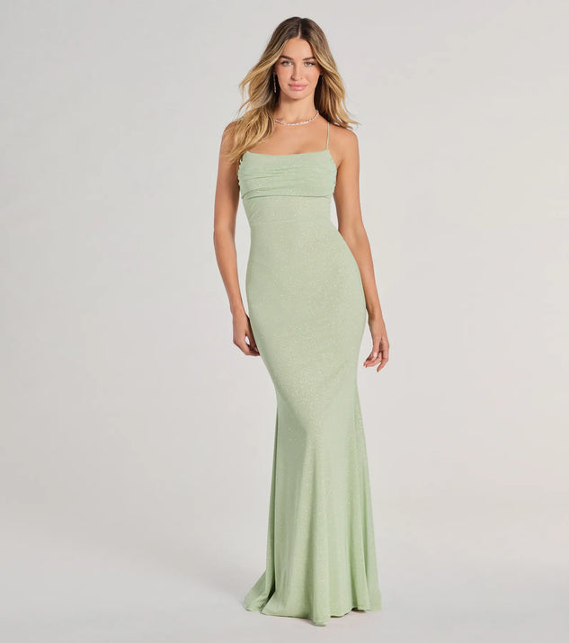 Turn heads at Prom 2025 in this sage green prom dress, where statement-making details meet the iconic style of the Molly Lace-Up Mermaid Glitter Formal Dress .