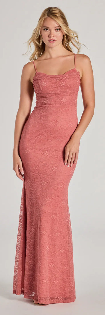 Turn heads at Prom 2025 in this rose prom dress, where statement-making details meet the iconic style of the Lylah Lace Cowl Neck Mermaid Dress .