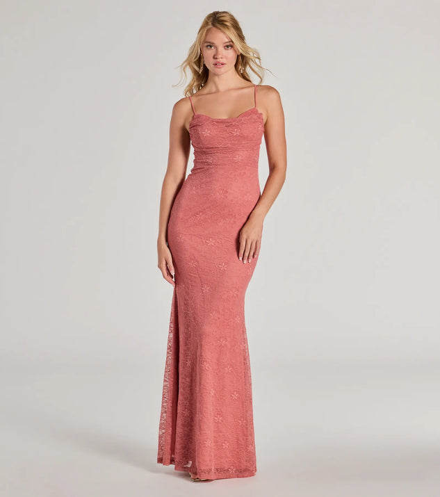 Turn heads at Prom 2025 in this rose prom dress, where statement-making details meet the iconic style of the Lylah Lace Cowl Neck Mermaid Dress .