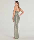 The Maia High-Slit Foiled Long Dress in sage is a stunning green prom dress designed to capture attention with its fresh or bold color and effortlessly stylish silhouette.
