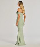 The Charlene Formal Faux Pearl Mesh Mermaid Dress in sage is a stunning green prom dress designed to capture attention with its fresh or bold color and effortlessly stylish silhouette.